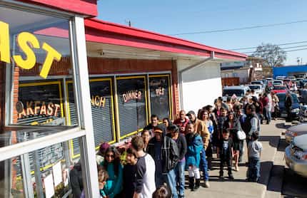 People lineup for Norma's annual roll back deals, including its anniversary special and...