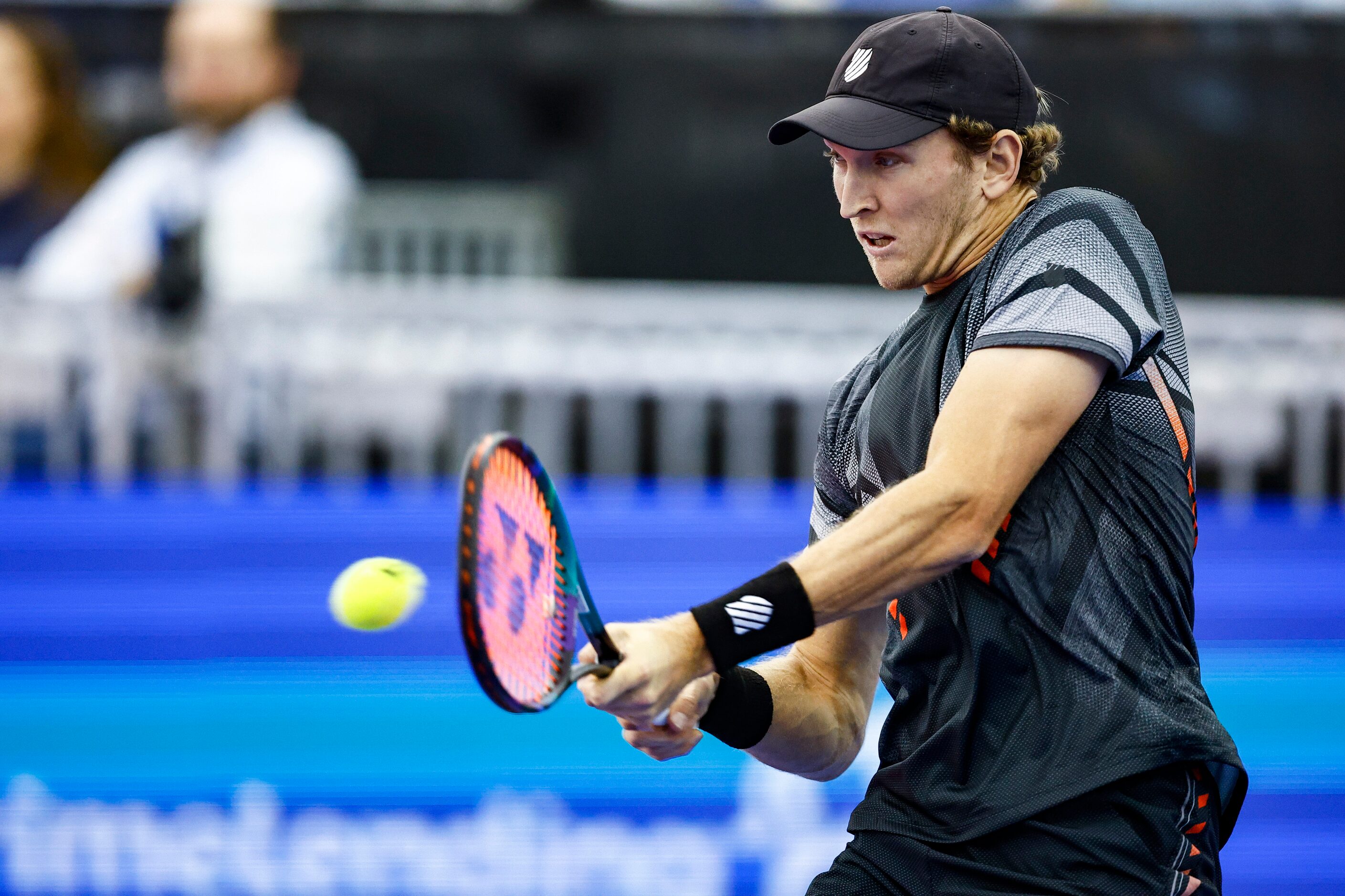 Mitchell Krueger, a Fort Worth native, returns the ball in a match against Yoshihito...