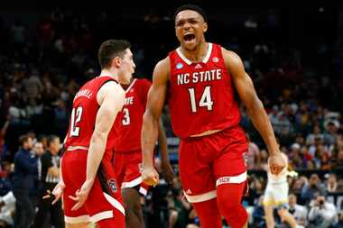 North Carolina State guard Casey Morsell (14) reacts after a teammate’s three-pointer during...
