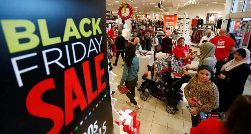 Shoppers rush in to the J.C. Penney store in Timber Creek Crossing on Skillman Street in...