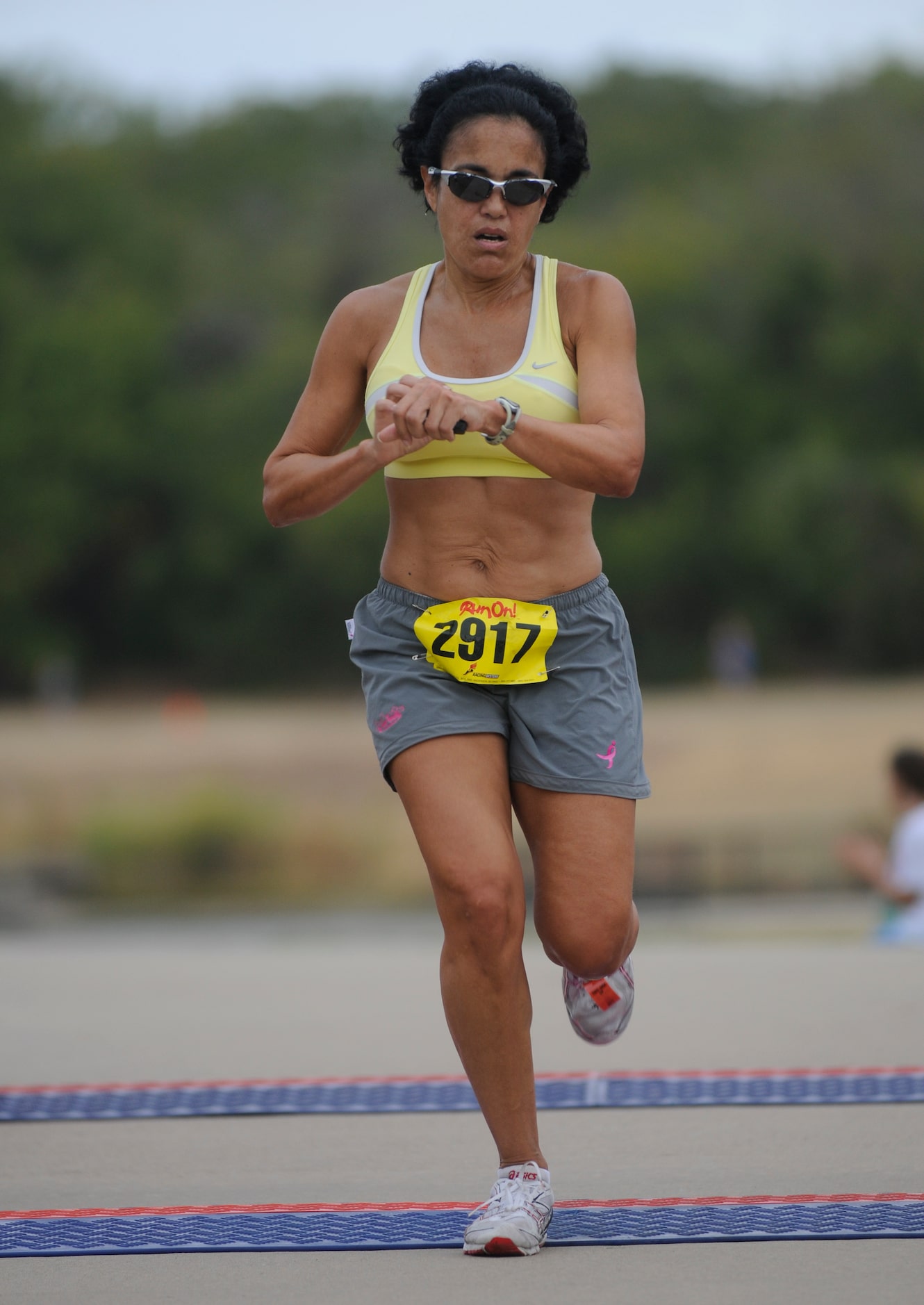 Yolanda Hopping finishes the CiCi's Pizza Barefoot Run in Coppell.