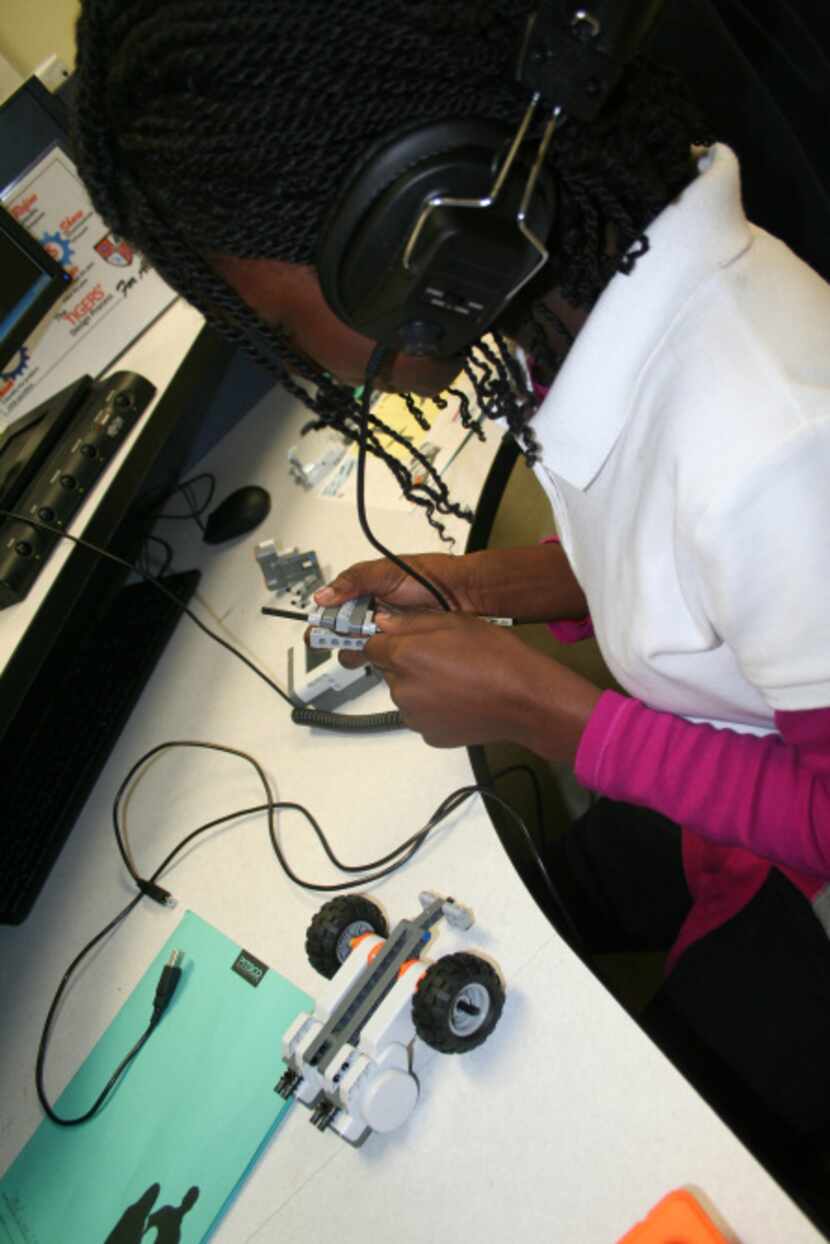 Jabria Wair-ray works at the robotics station at the George Washington Carver 6th Grade STEM...
