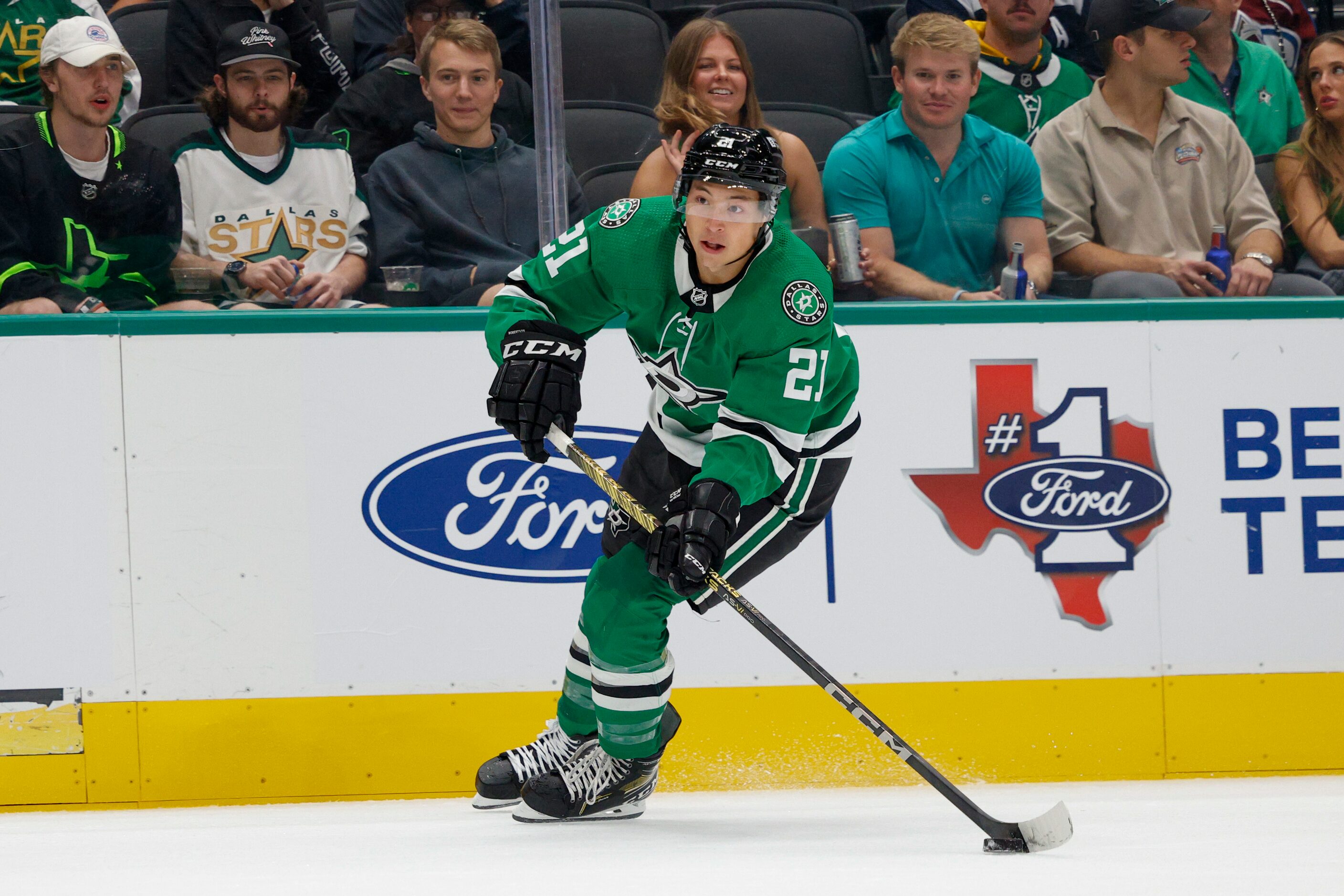 Dallas Stars left wing Jason Robertson (21) skates with the puck during the first period of...