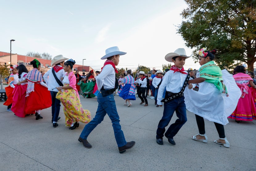 Students from Jack Lowe Sr. Elementary School dance Folklórico during the Festival of Lights...