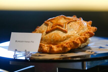 The new burger hand pie at AT&T Stadium is filled with beef, bacon, grilled onions and cheese.