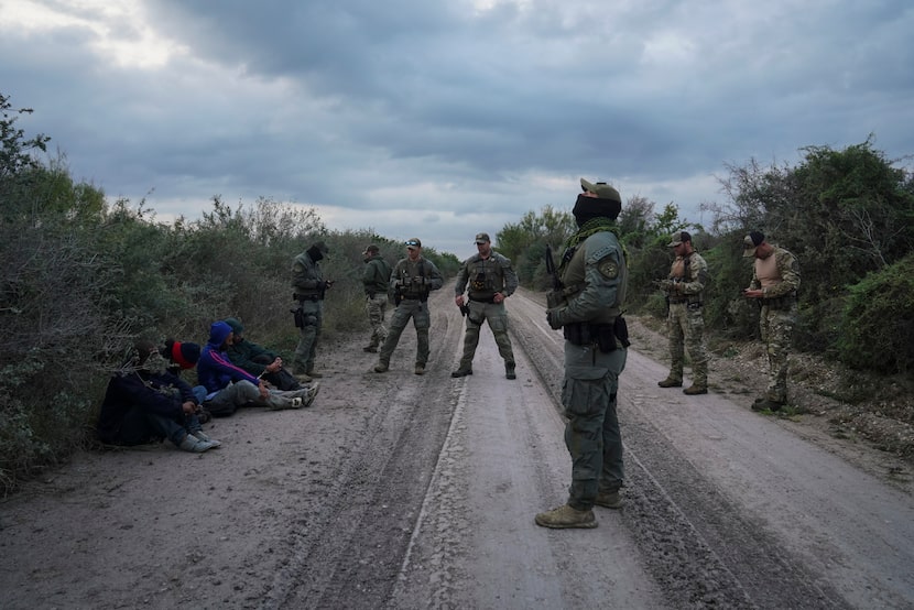 Texas Department of Public Safety special agents oversee a group of four Honduran...