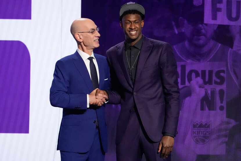 Olivier-Maxence Prosper poses for a photo with NBA Commissioner Adam Silver after being...