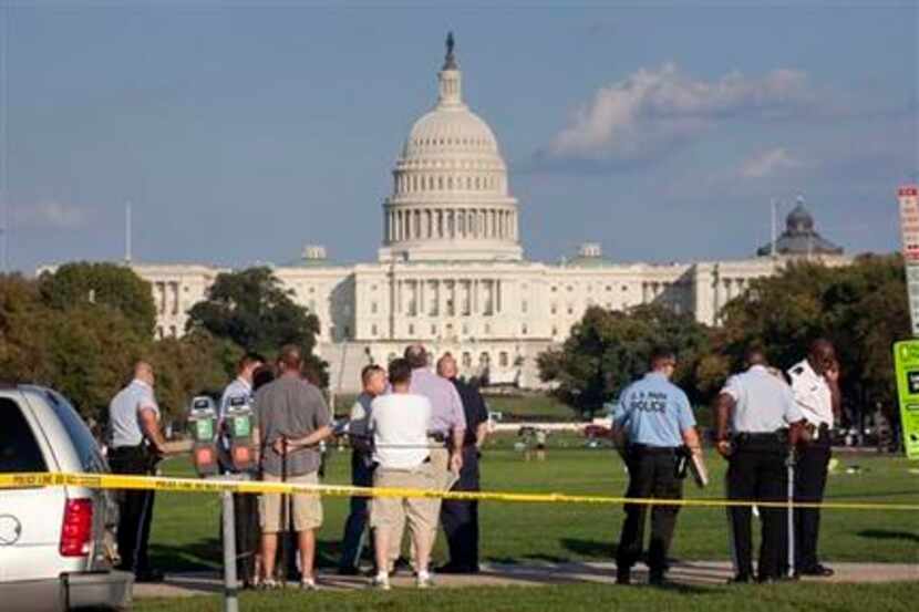Law enforcement officers are near the scene on the National Mall in Washington, where,...