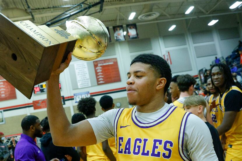 Richardson guard Tre Howell (5) lifts the championship trophy after the Whataburger boys...