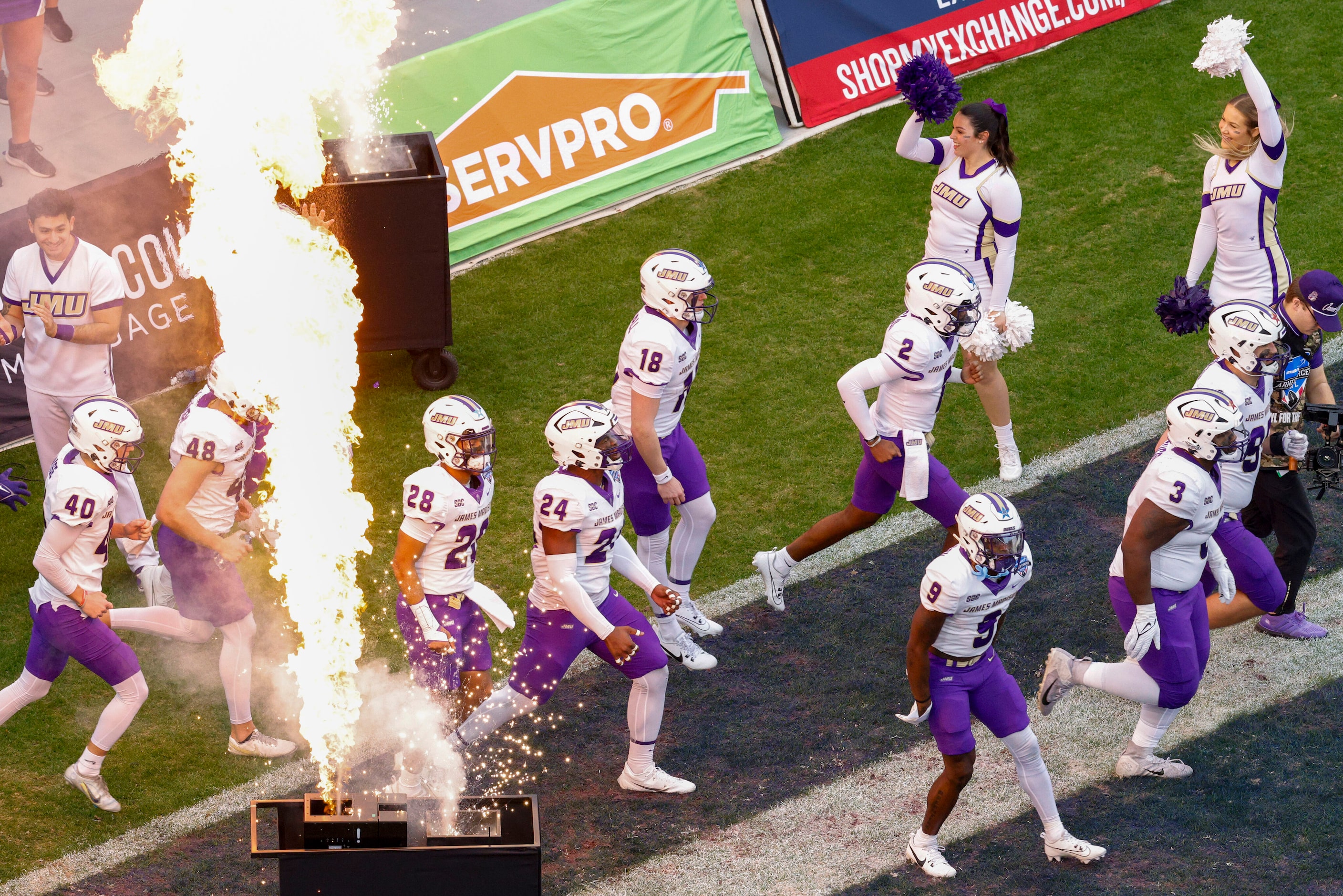 James Madison players take the field before the first half of the Armed Forces Bowl NCAA...