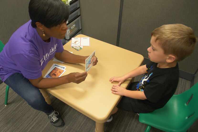 A therapist provides one-on-one lessons for a Life Skills Autism Academy client.
