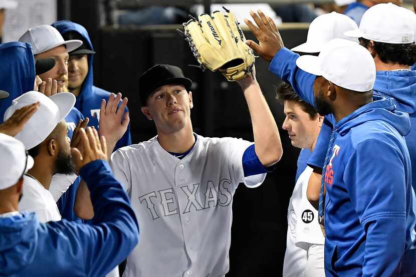 CHICAGO, ILLINOIS - AUGUST 24: Kolby Allard #39 of the Texas Rangers celebrates in the...