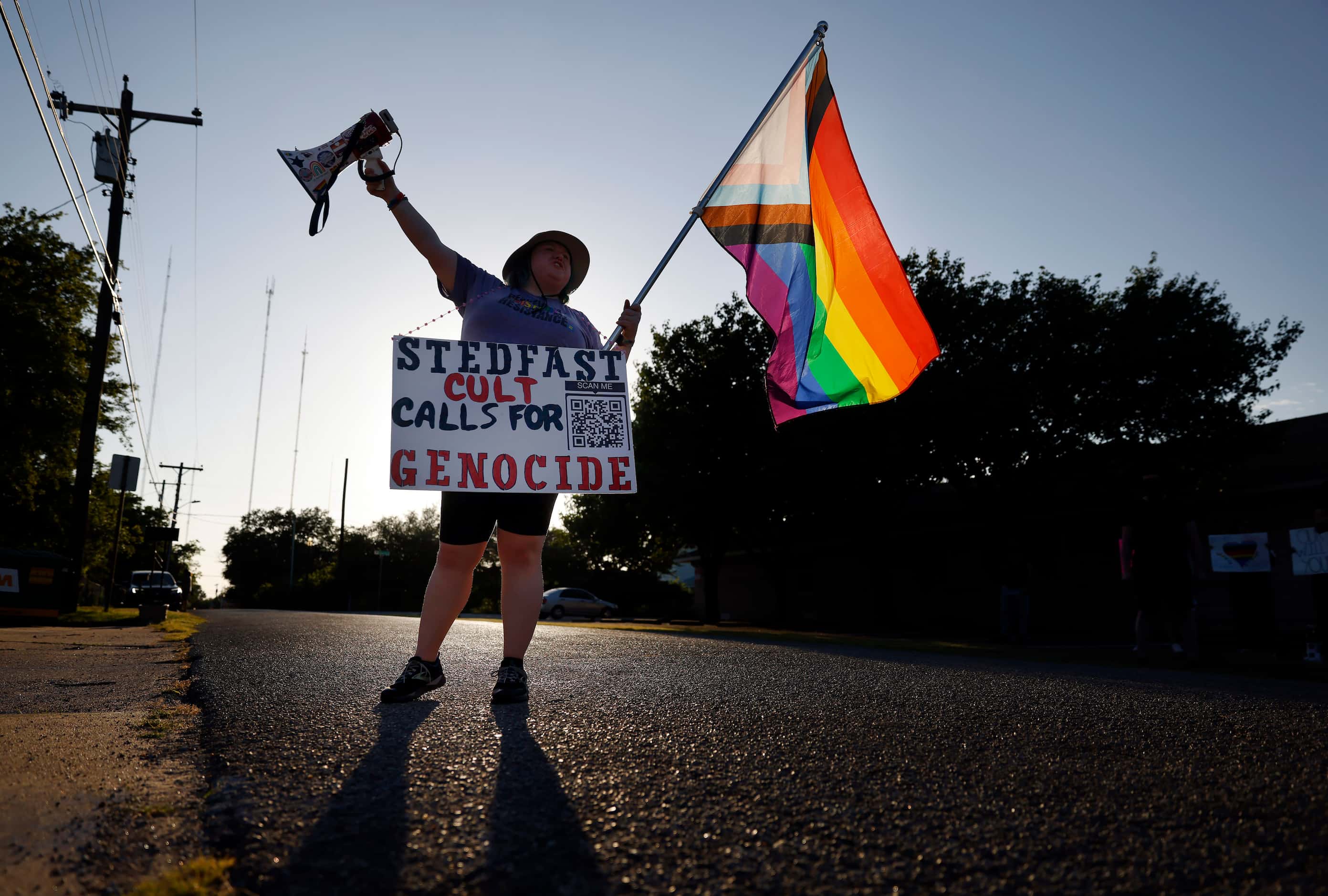 Protestor ‘Rain’ Knight of No Hate In Texas paces back and forth in front the New...