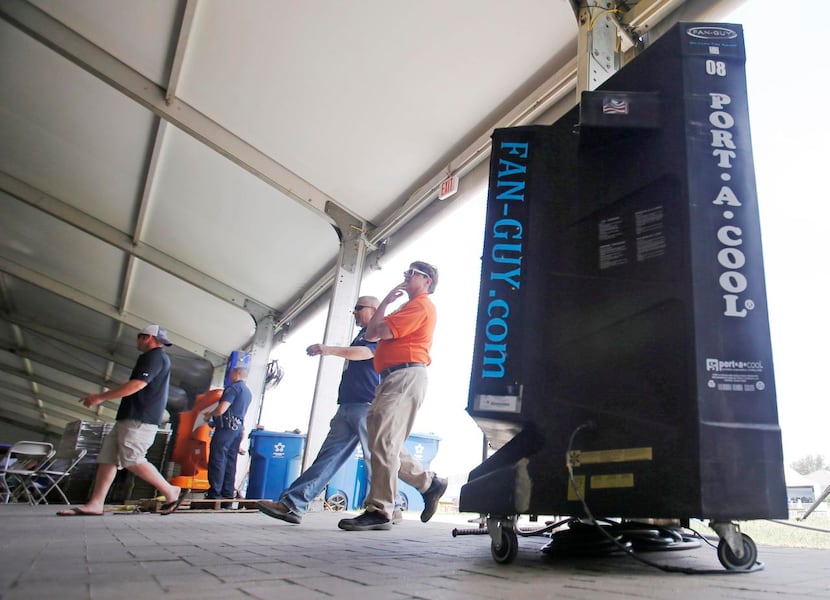 
People walk by a Portacool unit in the pavilion area at the AT&T Byron Nelson in Las Colinas.
