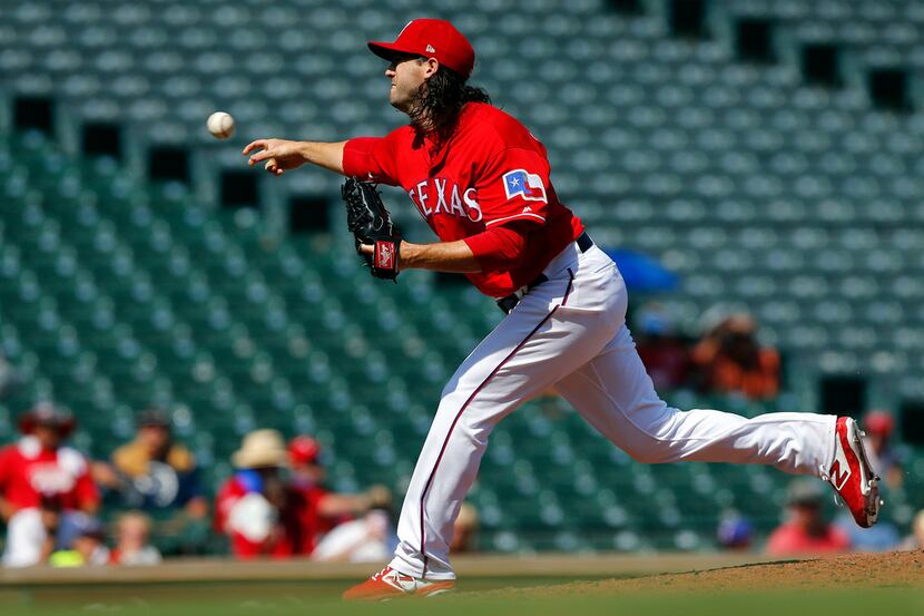 Texas Rangers relief pitcher Cory Gearrin (44) came in to close out their win against the...