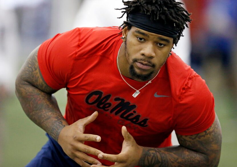 Defensive tackle Robert Nkemdiche steps into an agility drill at Mississippi's NFL football...