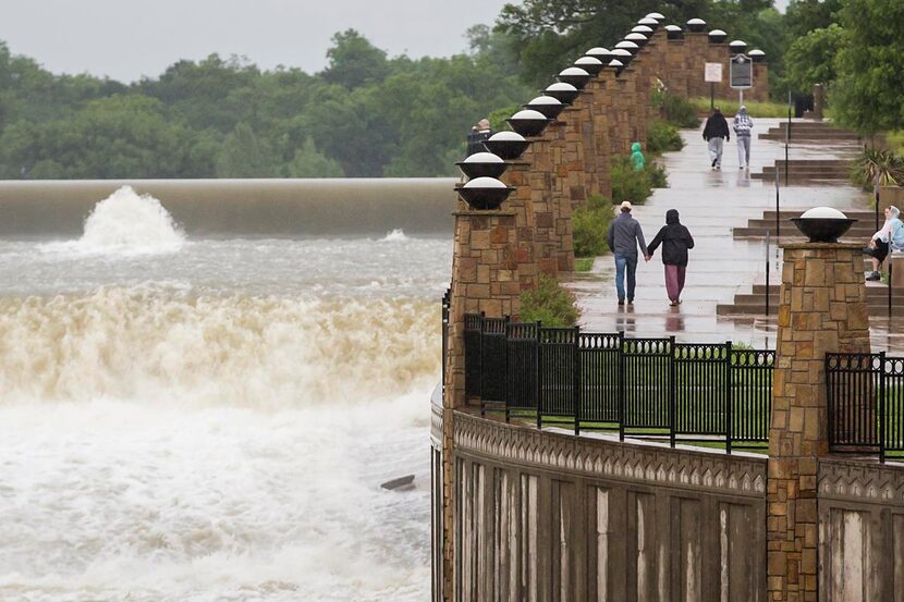 
Water streams over the White Rock Lake spillway in Dallas.
