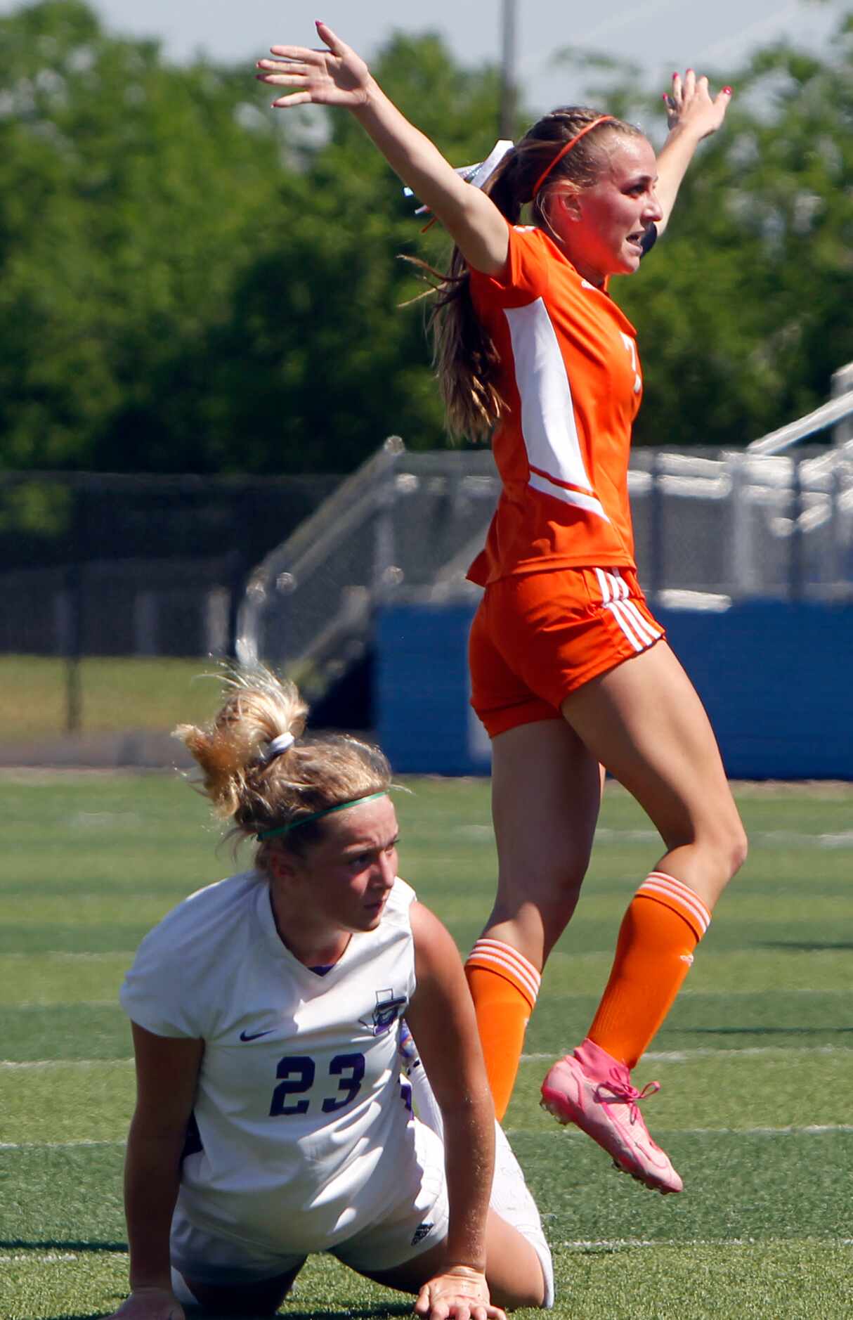 Celina's Lexi Tuite (7) reacts in celebration of her goal over the defense of Boerne's...
