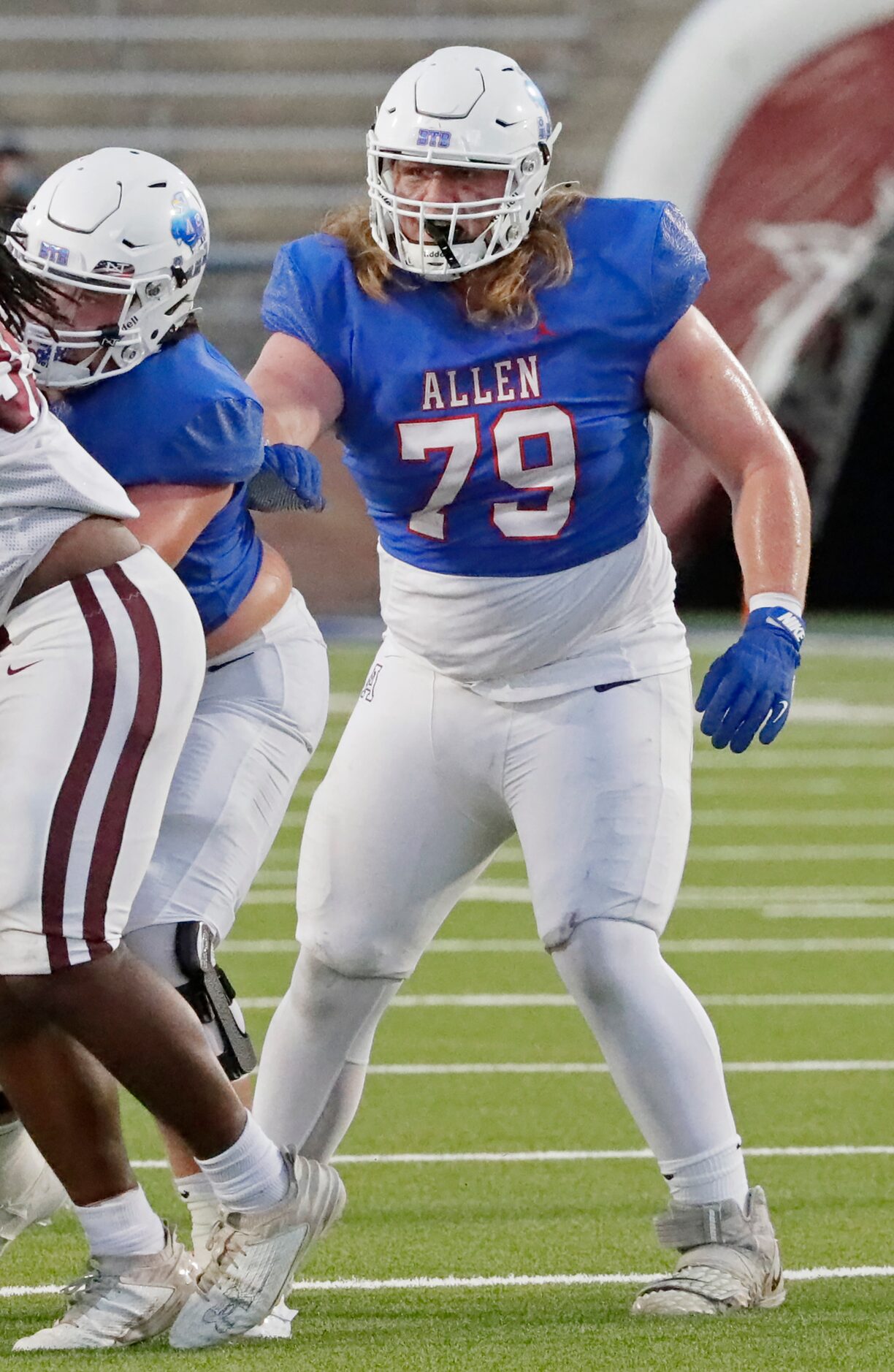 Allen High School offensive lineman Colter Alberding (79) looks to block during the first...