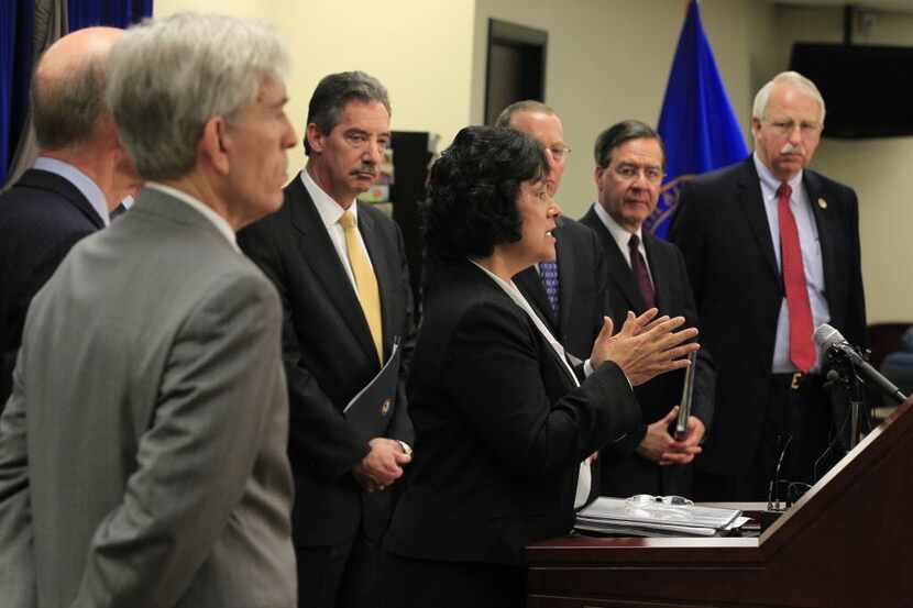 U.S. Attorney for the Northern District of Texas Sarah Saldana (at podium) and other...