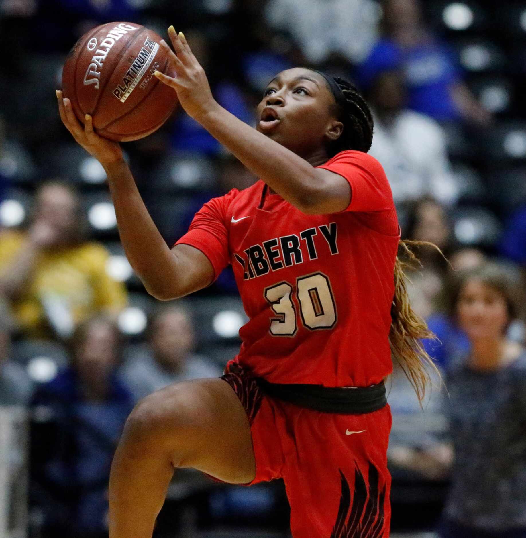 Frisco Liberty High School guard Jazzy Owens-Barnett (30) goes in for a lay up during the...