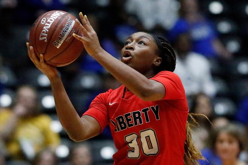Frisco Liberty High School guard Jazzy Owens-Barnett (30) goes in for a lay up during the...