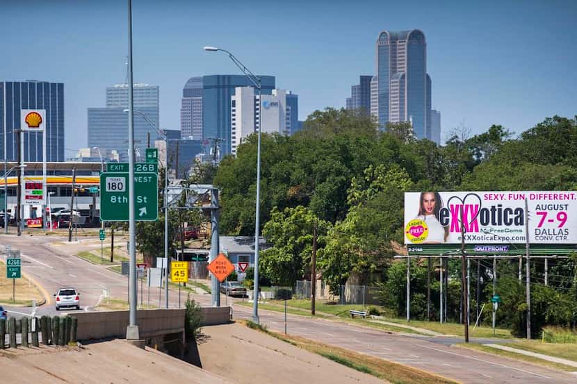 
A billboard on Interstate 35E south of downtown Dallas advertises the Exxxotica expo that’s...
