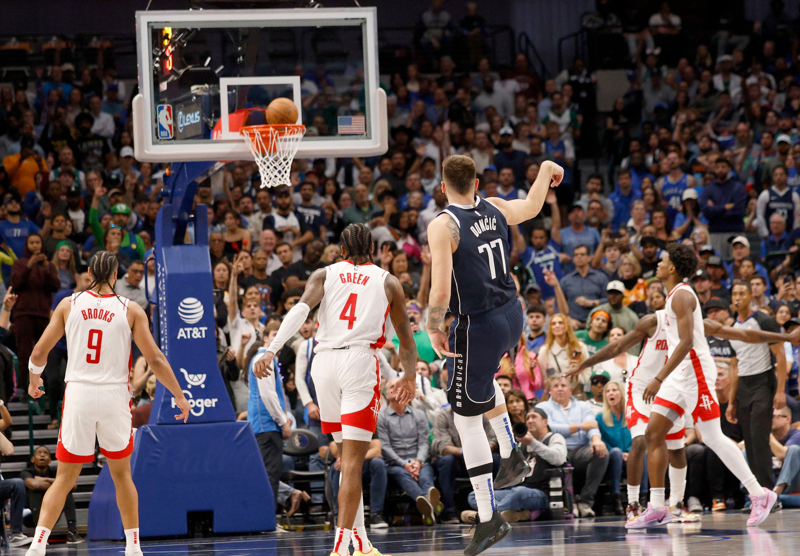 Dallas Mavericks guard Luka Doncic (77) shoots a three-point shot against the Houston...