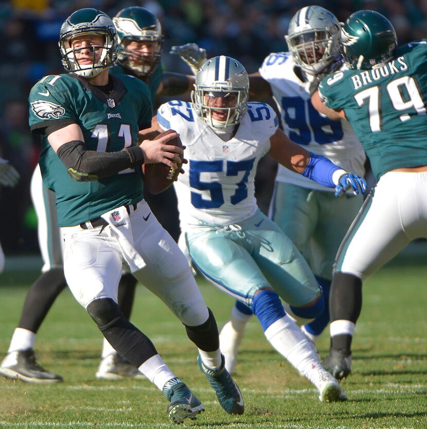 Dallas Cowboys linebacker Damien Wilson (57) puts pressure on Philadelphia Eagles...