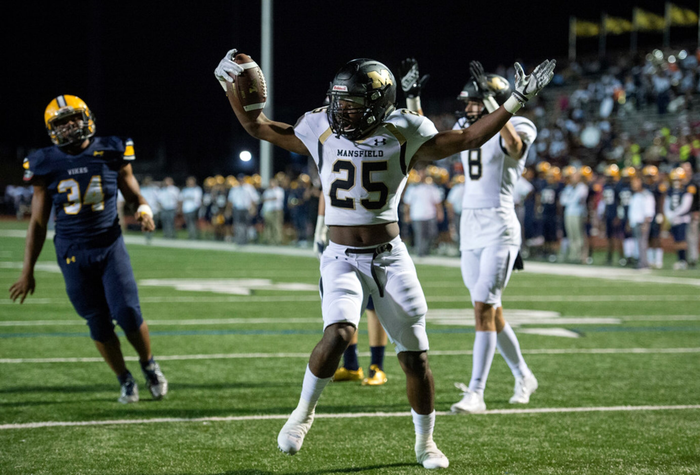 Mansfield senior running back Jaqulis Coleman (25) celebrates after scoring the first...