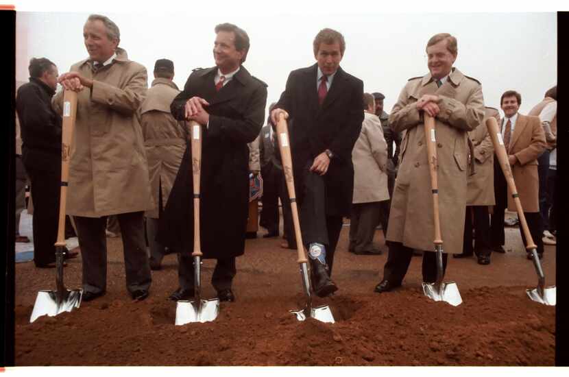 (Left to right) Edward Rose, Texas Rangers; Arlington Mayor Richard Greene; George W. Bush,...