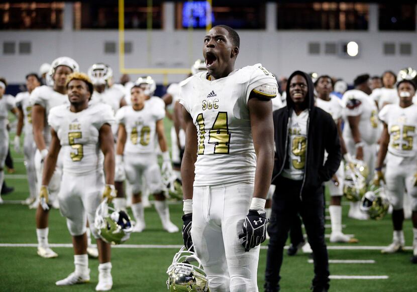 South Oak Cliff defensive lineman Steven Parker (14) reacts to the highlights being played...