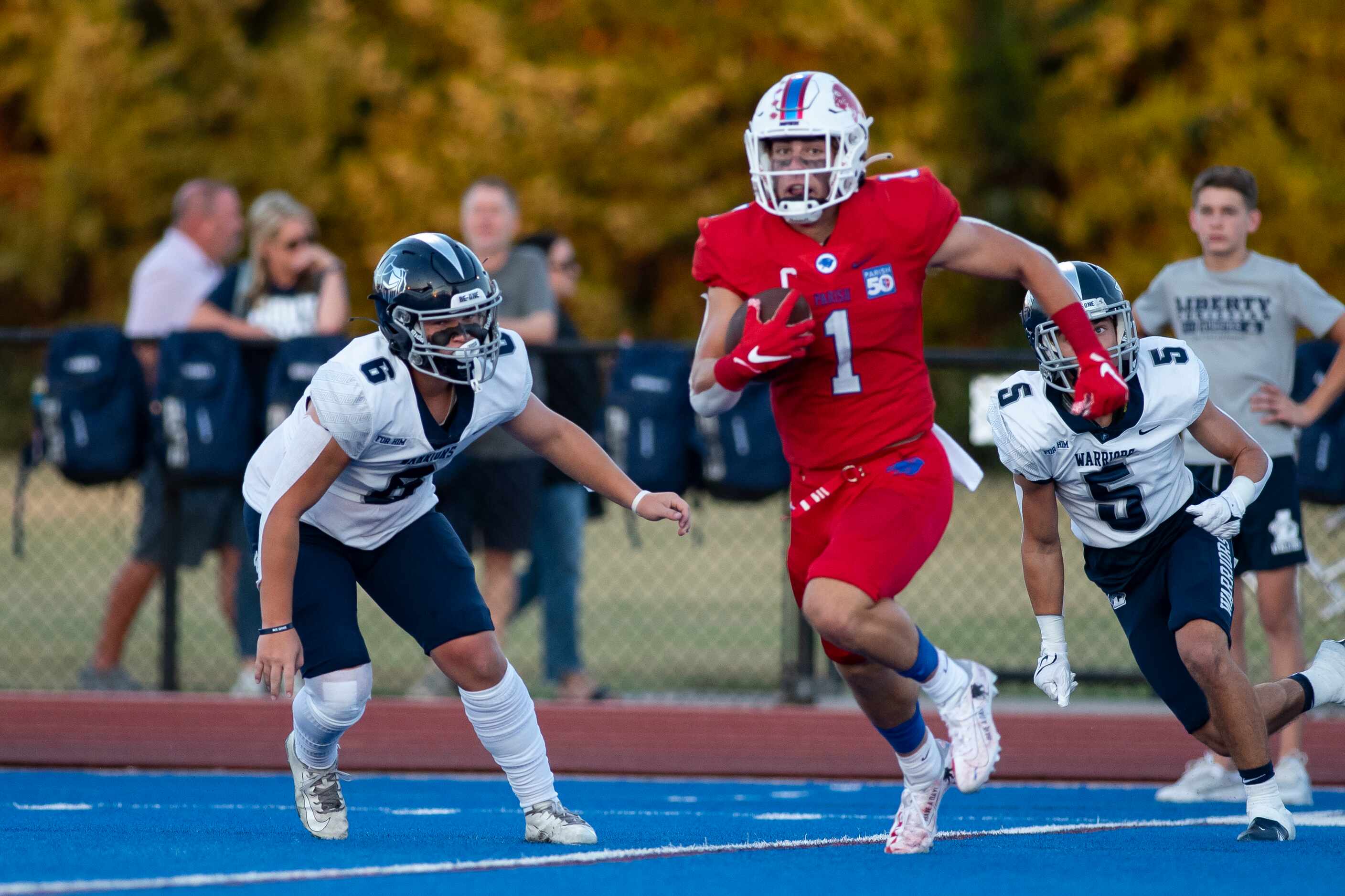 Parish Episcopal senior Blake Youngblood (1) crosses the field after catching a pass during...