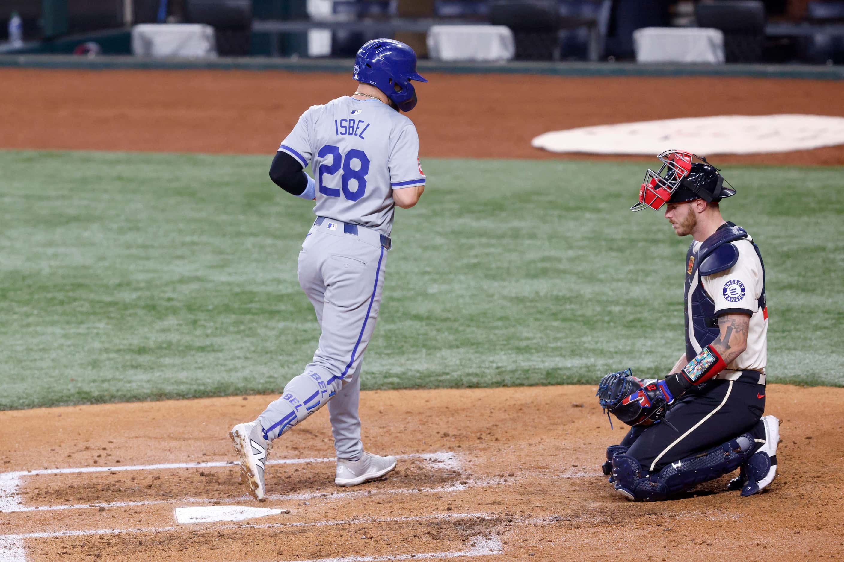 Kansas City Royals outfielder Kyle Isbel (28) is back to home plate after hitting a home run...