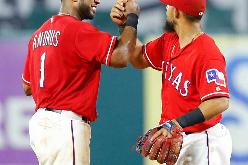 Texas Rangers shortstop Elvis Andrus (1) and second baseman Rougned Odor (12) congratulate...