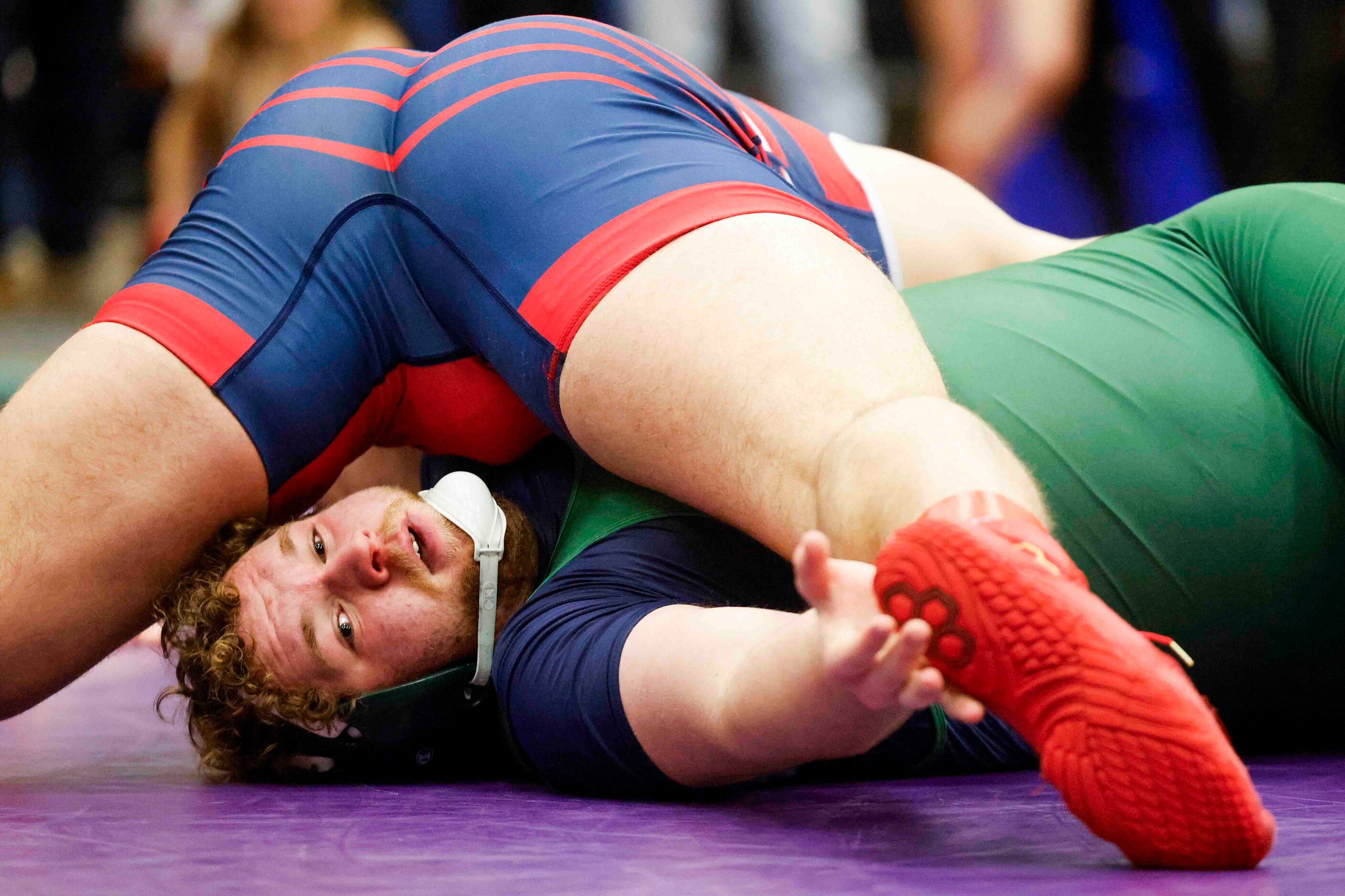 Jett Hanlin of Frisco Reedy (bottom) wrestles with Jaxson Lee of Northwest during 5A Region...