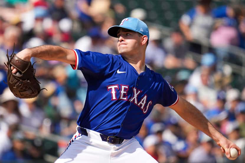 Texas Rangers pitcher Cody Bradford delivers during the first inning of a spring training...