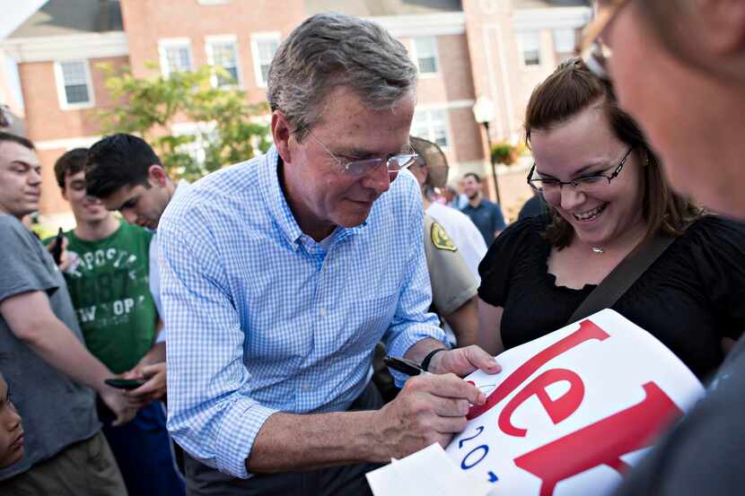 Jeb Bush signed  one of his campaign signs in Pella, Iowa, following his announcement last...