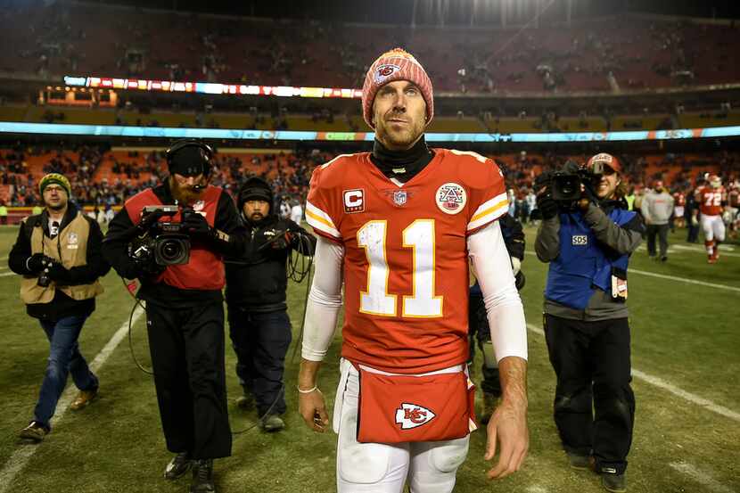 Kansas City Chiefs quarterback Alex Smith (11) walks off the field after the Chiefs lost to...