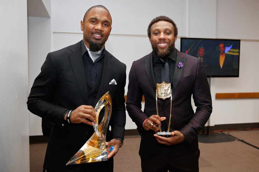 Former NFL player Charles Woodson, left, holds the Art Rooney award, and Kansas City Chiefs'...