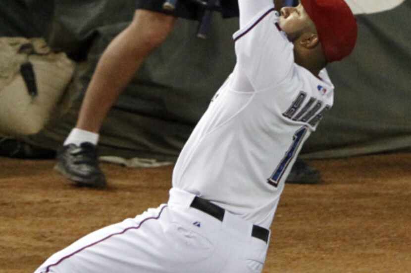 Texas Rangers right fielder Nelson Cruz (17) hits a grand slam off Houston Astros starting...