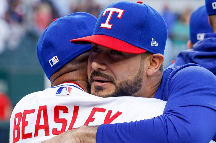 Texas Rangers starting pitcher Martin Perez (54) hugs Texas Rangers interim manager Tony...