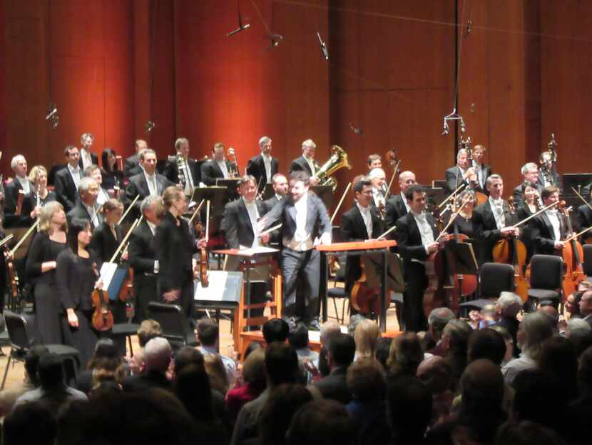 Guest conductor James Gaffigan acknowledges applause of the audience at a Houston Symphony...