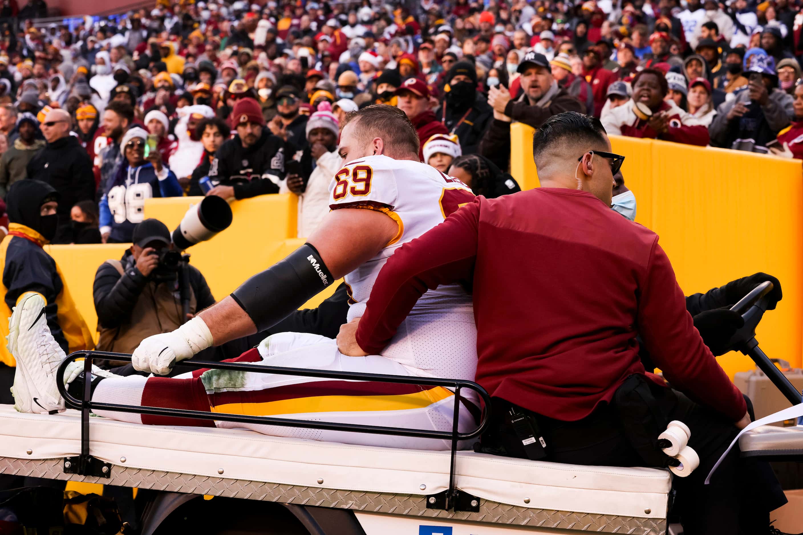 Washington Football Team center Tyler Larsen (69) gets carted out after getting hurt in a...