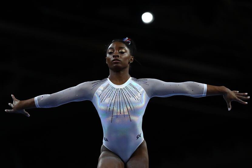 Simone Biles of the United States performs on the balance beam in the women's all-around...