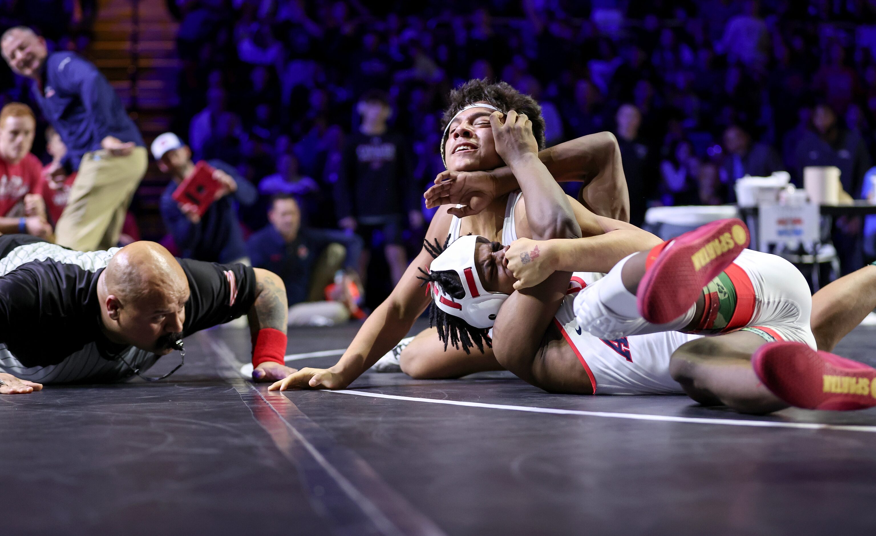 Javin Jackson-Bey (white) of Allen competes against Nicholas Zamora of Arlington Martin in...