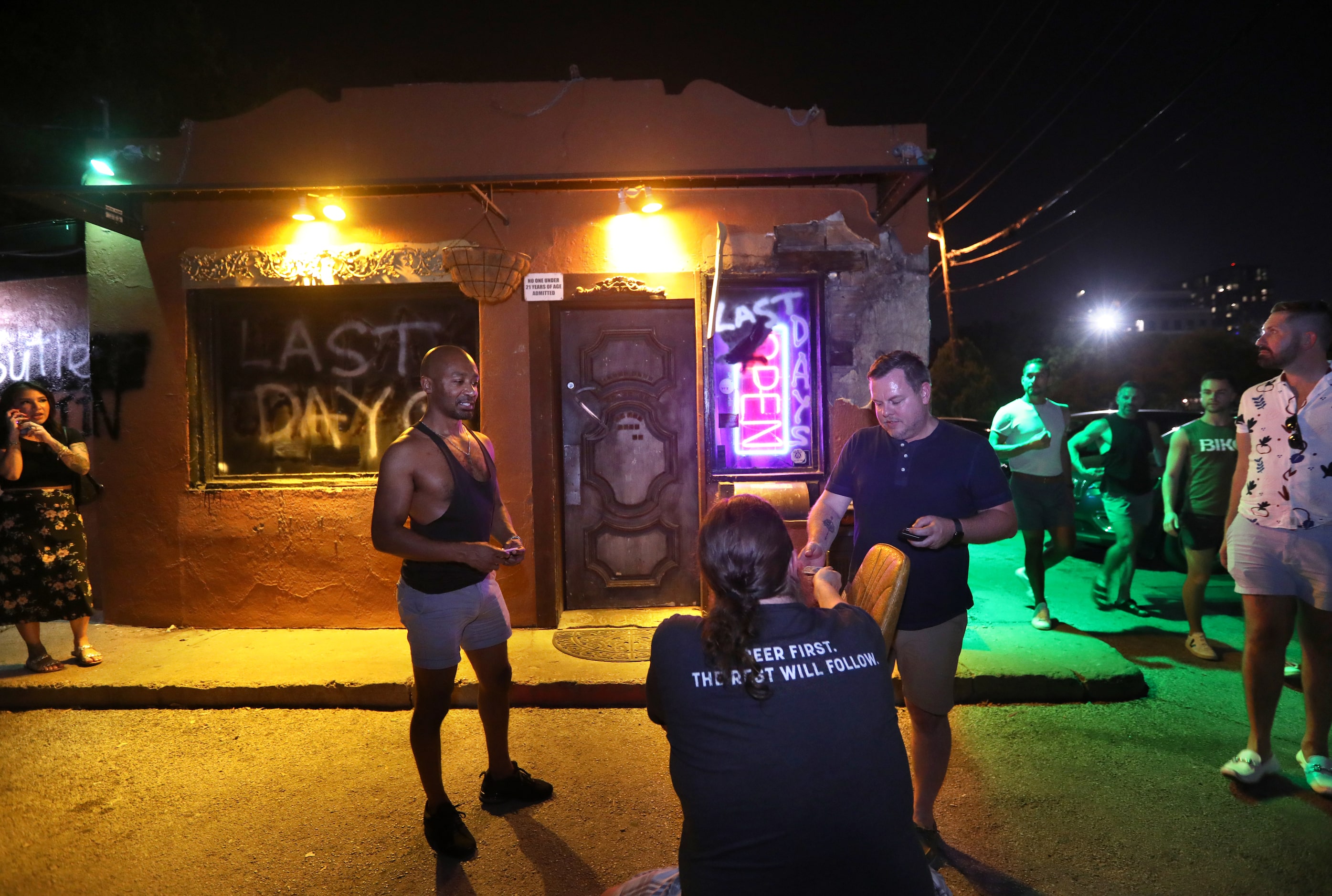 Shane Chennell checks IDs at the Grapevine Bar in Dallas, TX, on Aug 23, 2023.  (Jason...