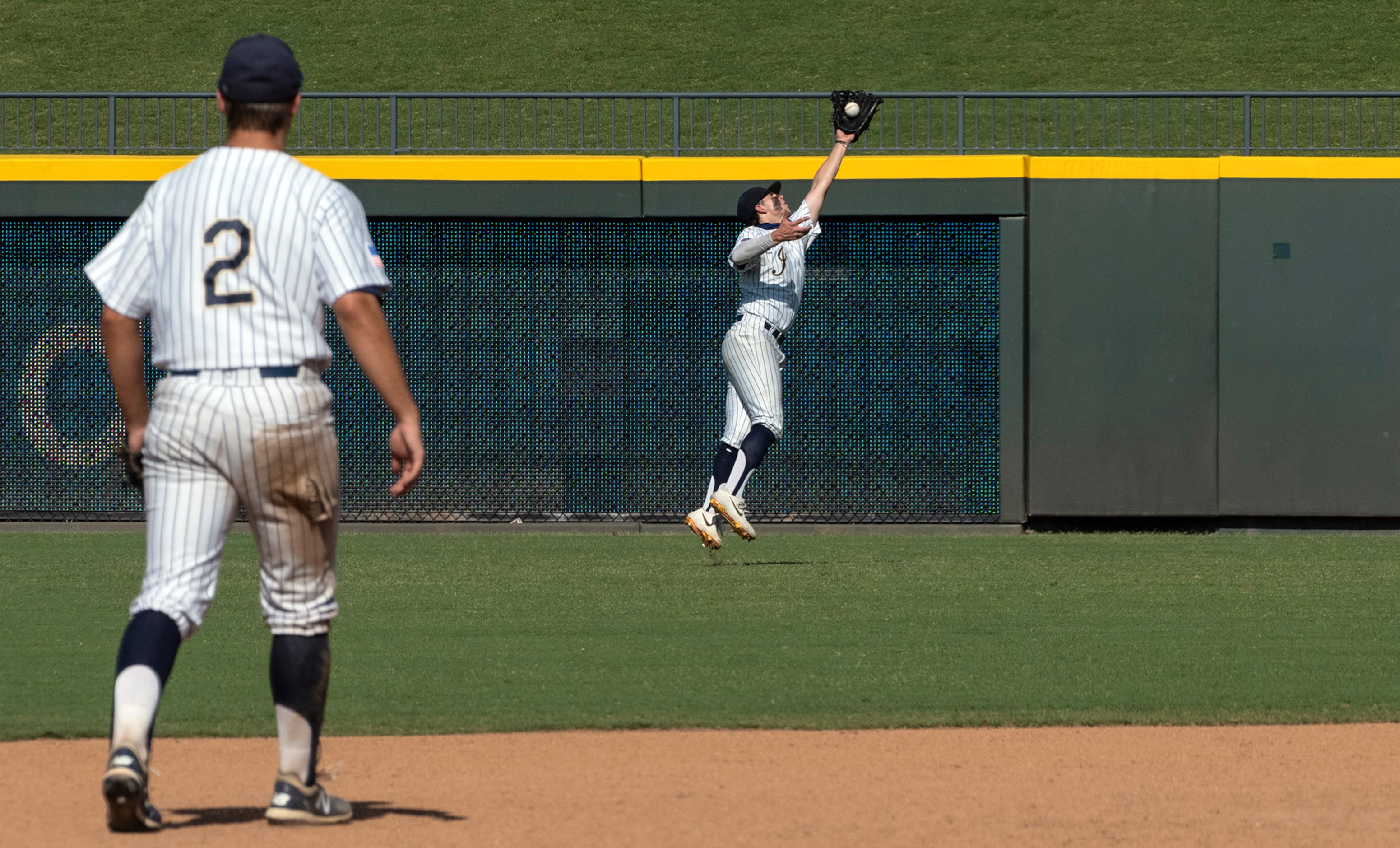 Keller Clayton Thomas, (7), runs down a fly ball hit by Houston Strake Jesuit Jacob Dorman,...