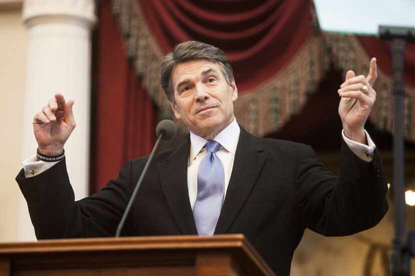  Gov. Rick Perry speaks on the opening day of Texas' biennial legislation season, at the...