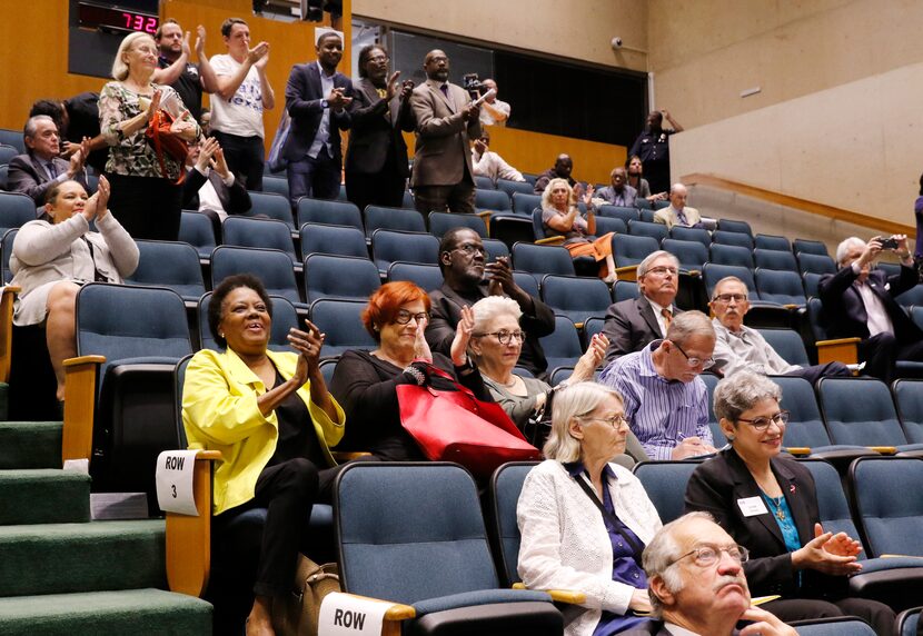 People react after the Dallas City Council voted 13-1 to remove the Robert E. Lee statue at...